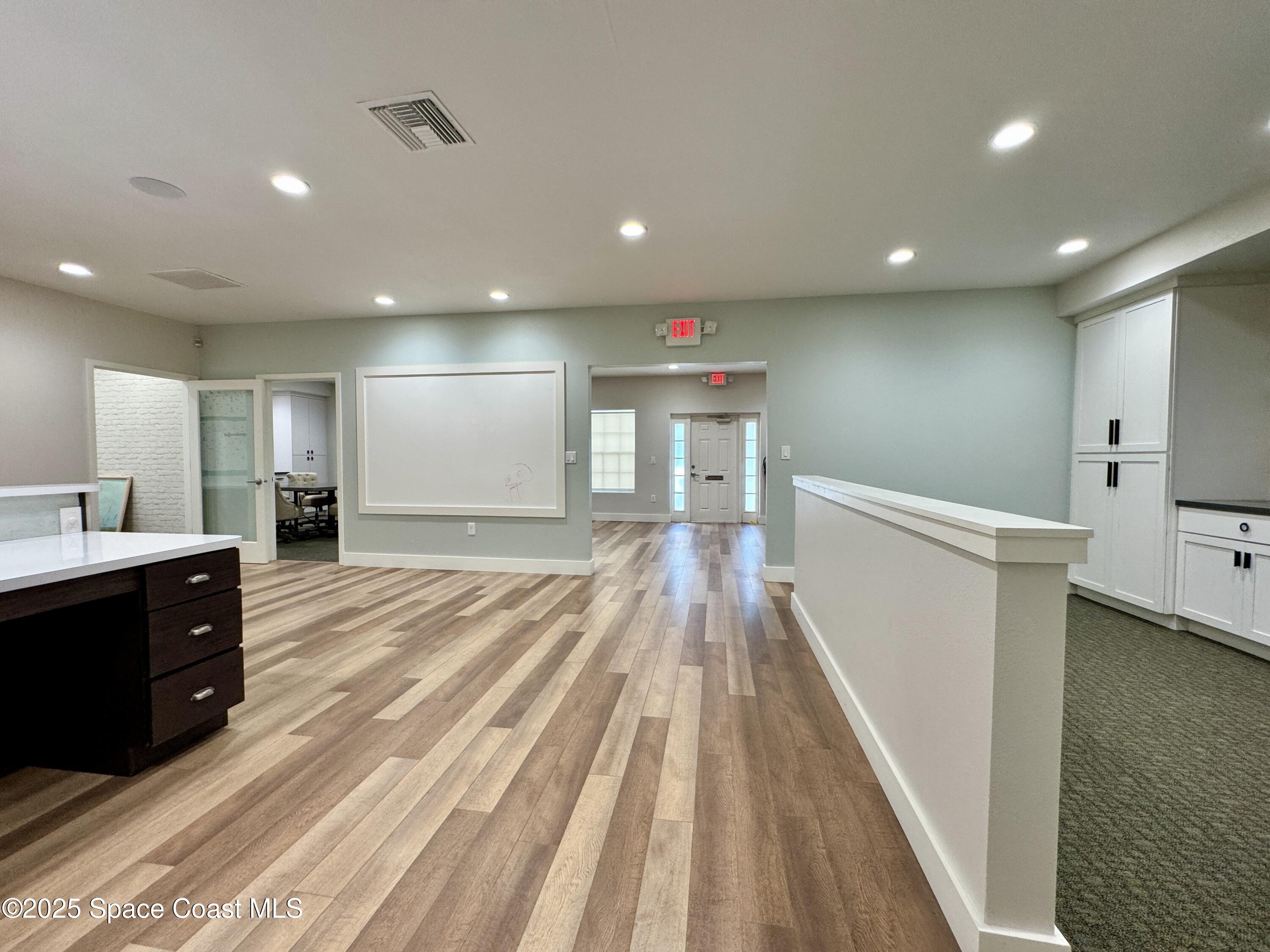 3210 North Wickham Road, Unit 2 Melbourne, FL 32935 - Photo 11 of 14 a spacious bathroom with a sink and a mirror