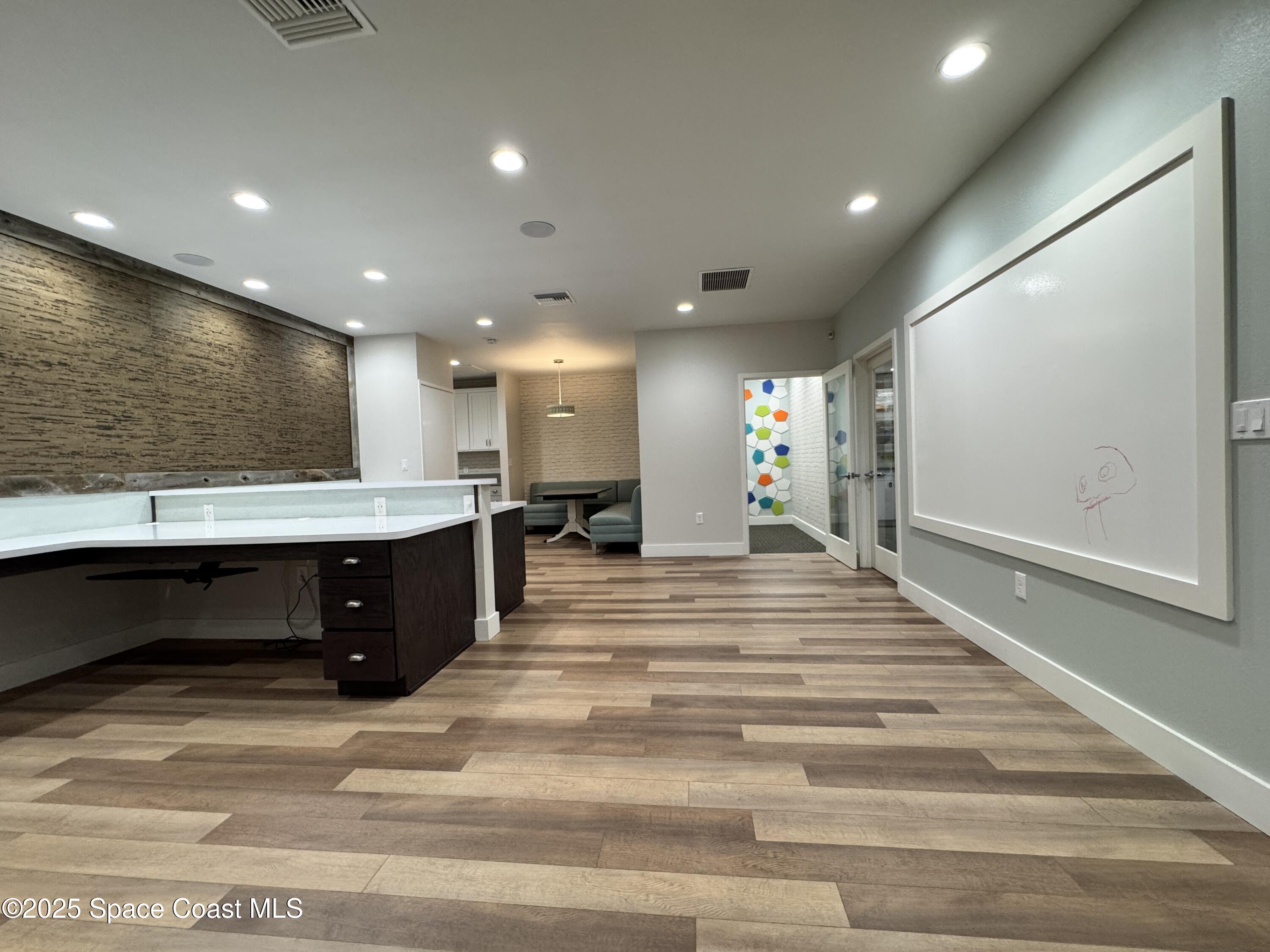 3210 North Wickham Road, Unit 2 Melbourne, FL 32935 - Photo 6 of 14 a spacious bathroom with a sink and a mirror