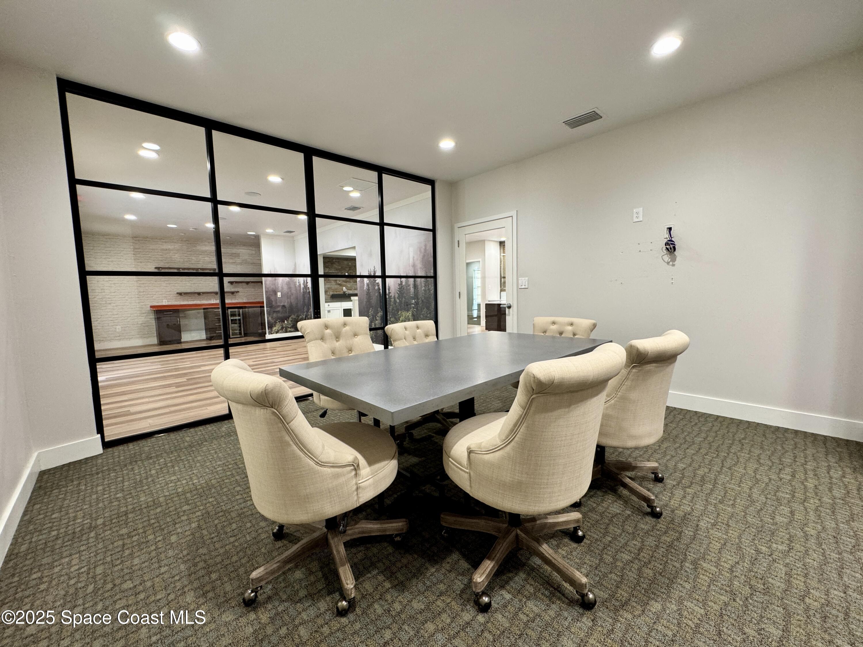 3210 North Wickham Road, Unit 2 Melbourne, FL 32935 - Photo 7 of 14 a view of a dining room with furniture