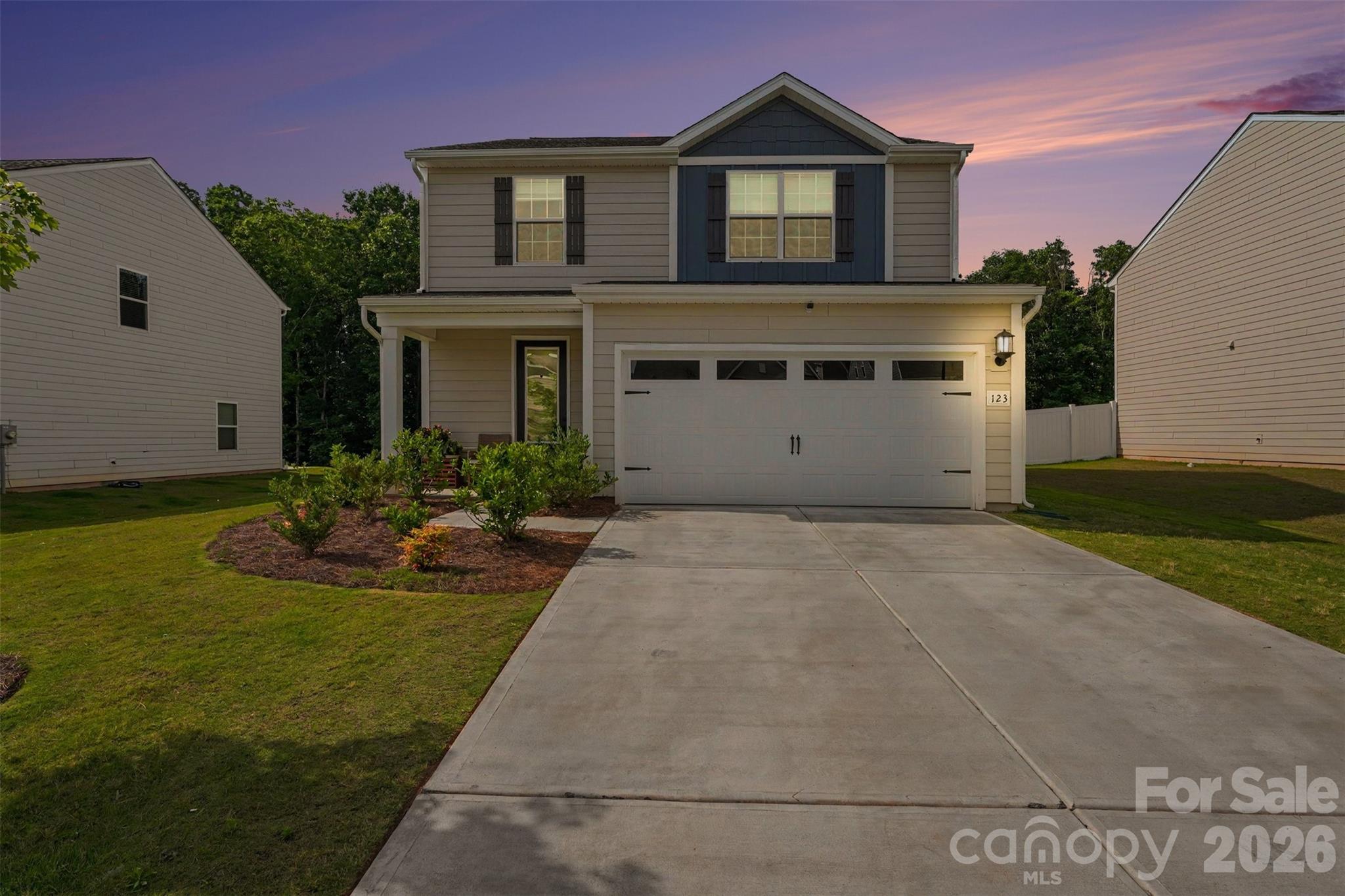 123 Brixham Loop Troutman, NC 28166 - Photo 14 of 18 a view of a house with backyard and garden