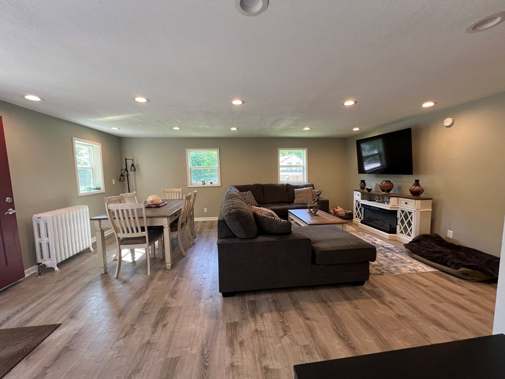 155 Cherry Run Road Rouseville, PA 16344 - Photo 2 of 19 a living room with furniture a wooden floor and a flat screen tv