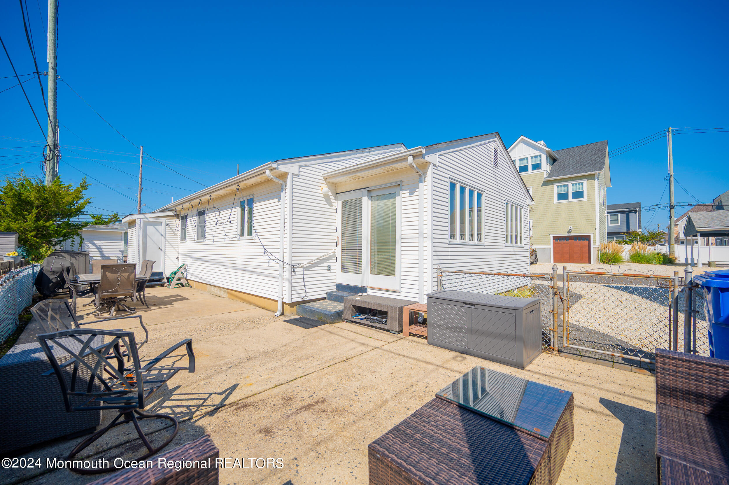 121 Jacobsen Lane Lavallette, NJ 08735 - Photo 14 of 19 a view of a house with pool and sitting area