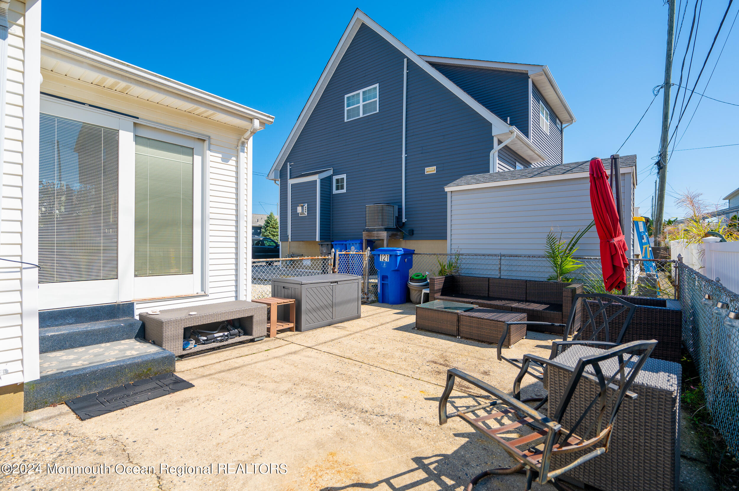 121 Jacobsen Lane Lavallette, NJ 08735 - Photo 15 of 19 a swimming pool with outdoor seating and patio