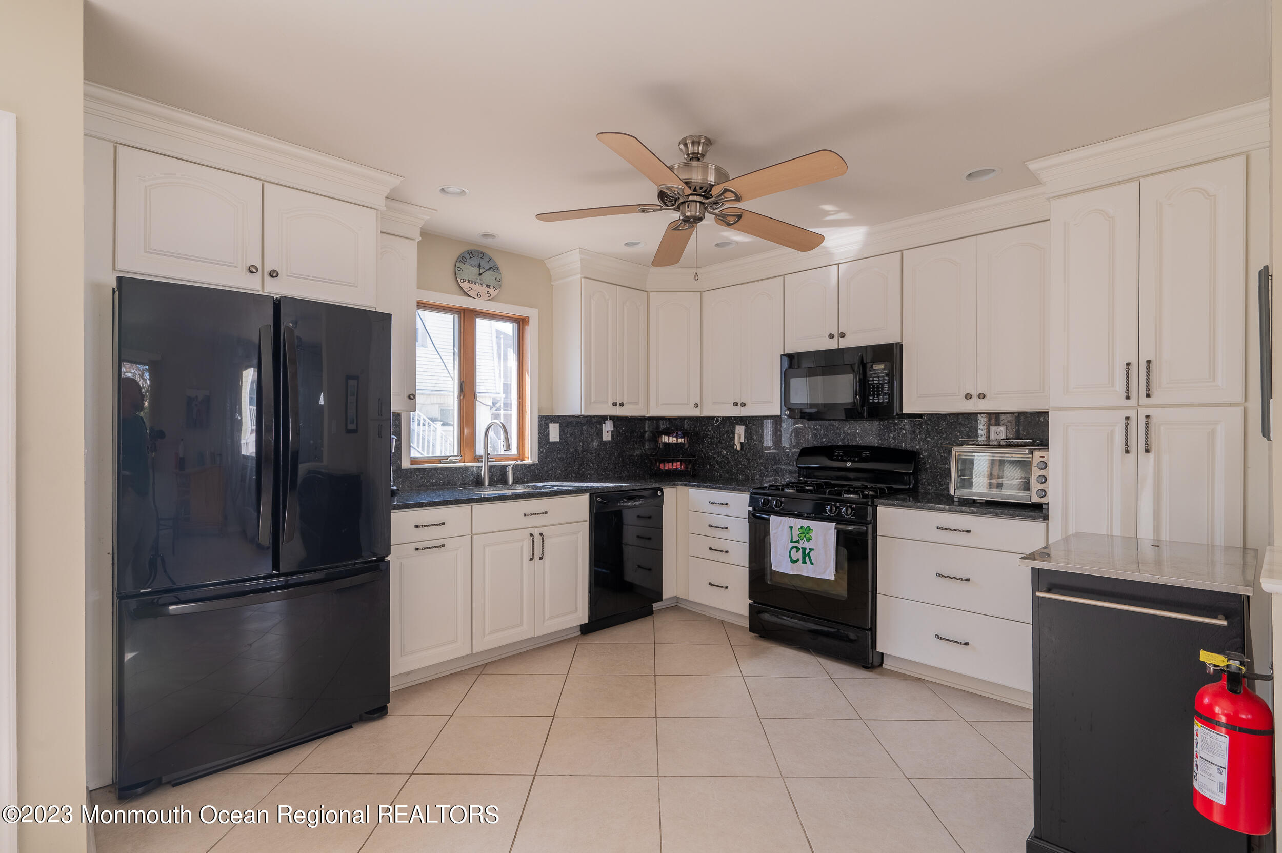 121 Jacobsen Lane Lavallette, NJ 08735 - Photo 2 of 19 a kitchen with a refrigerator stove and microwave