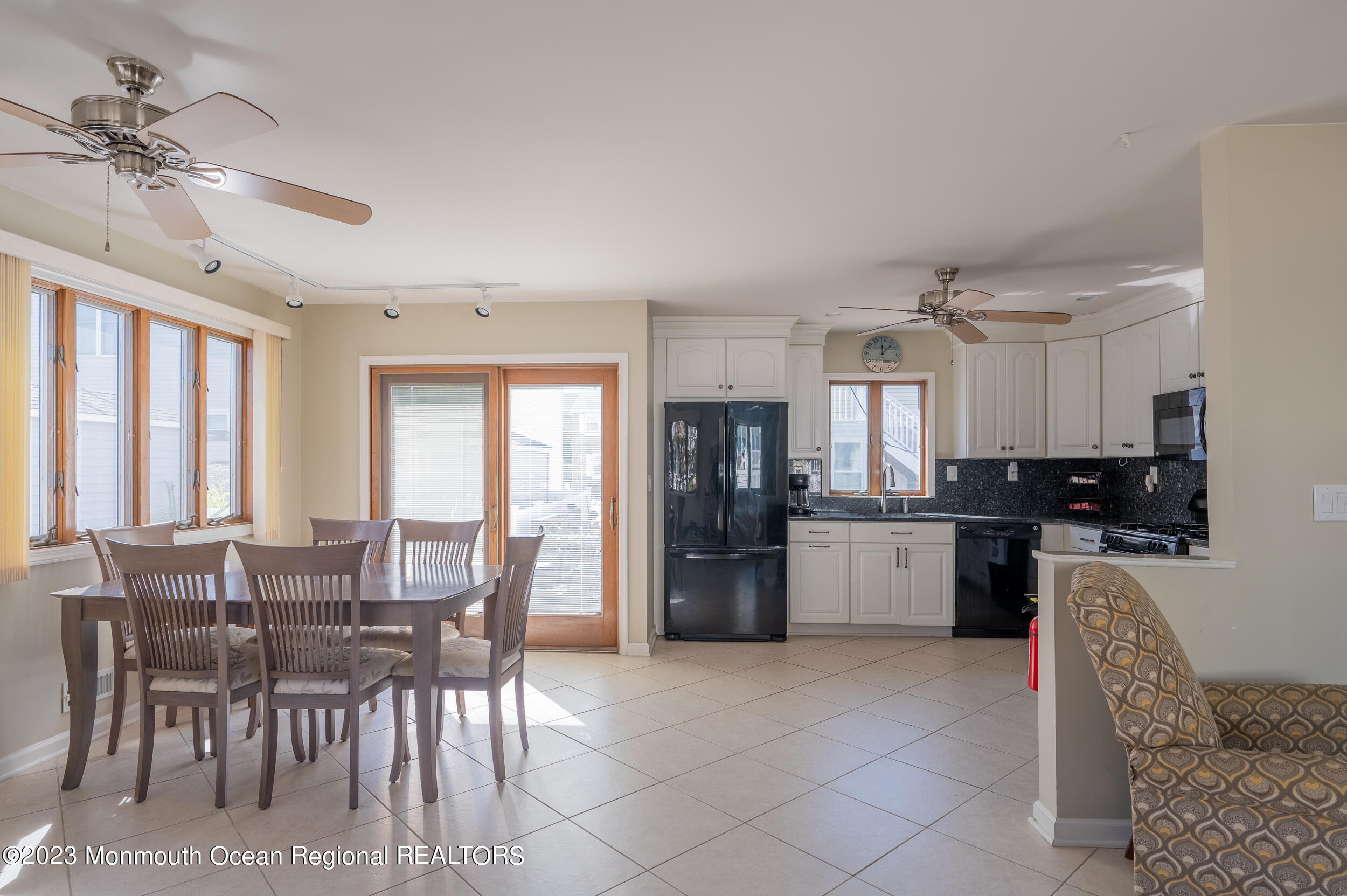 121 Jacobsen Lane Lavallette, NJ 08735 - Photo 3 of 19 a large kitchen with a table and chairs