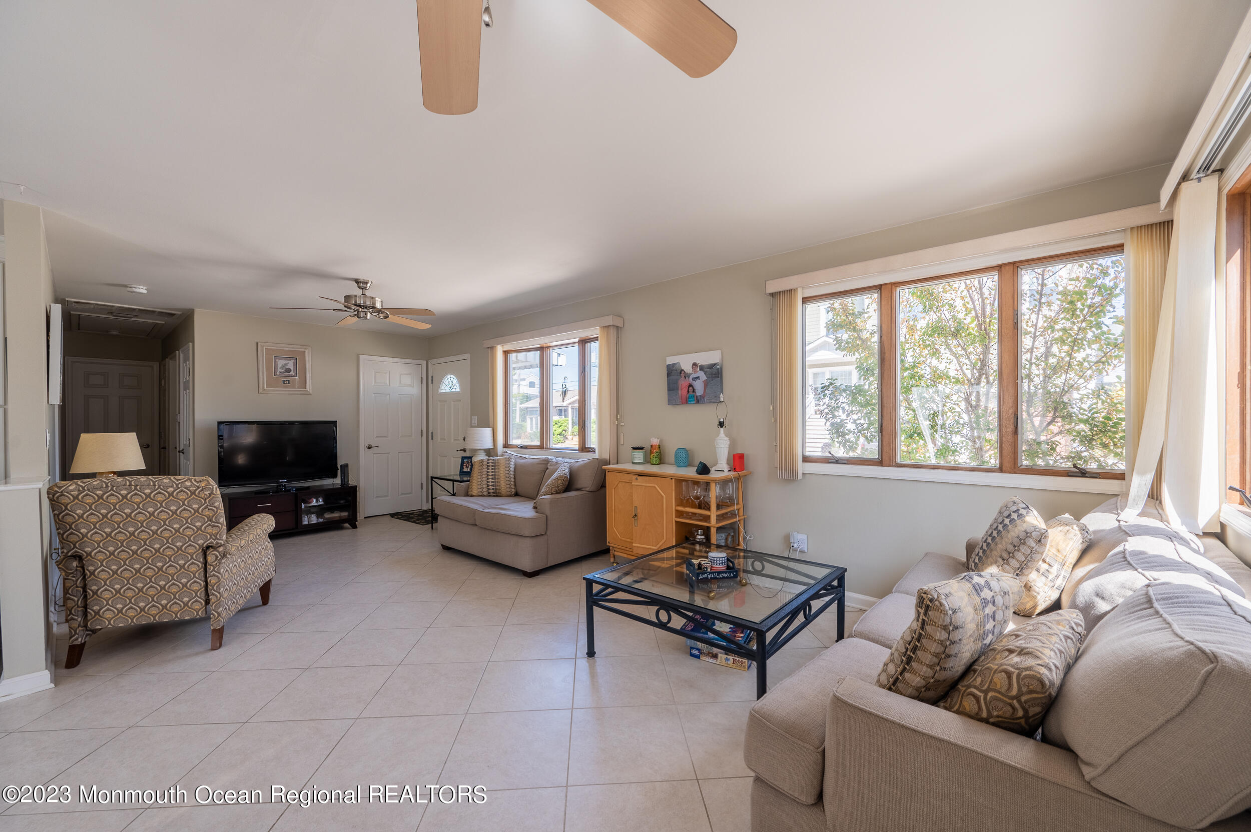 121 Jacobsen Lane Lavallette, NJ 08735 - Photo 6 of 19 a living room with furniture and a large window