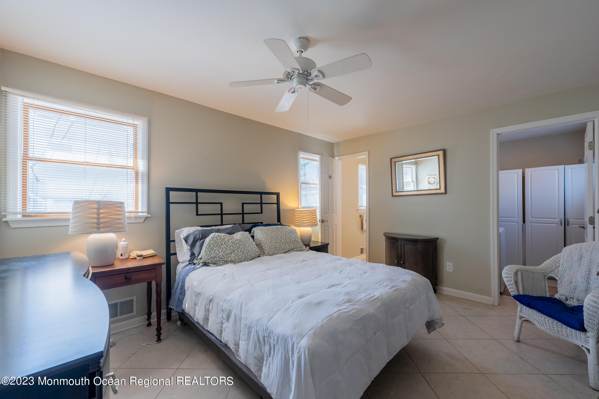 121 Jacobsen Lane Lavallette, NJ 08735 - Photo 8 of 19 a bedroom with a bed and window
