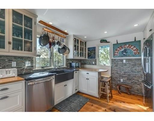 2 Gas House Lane Marblehead, MA 01945 - Photo 11 of 25 a kitchen with stainless steel appliances kitchen island granite countertop a sink and cabinets