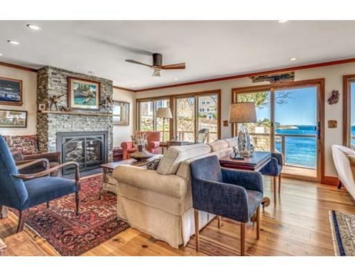 2 Gas House Lane Marblehead, MA 01945 - Photo 6 of 25 a living room with furniture a fireplace and a large window