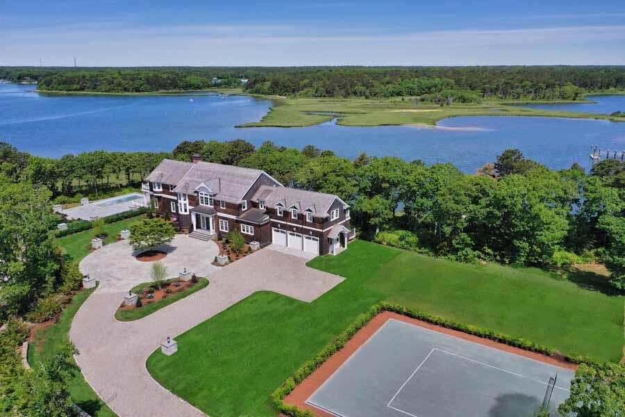160 Peppercorn Lane Cotuit, MA 02635 - Photo 1 of 43 an aerial view of a house with outdoor space and lake view
