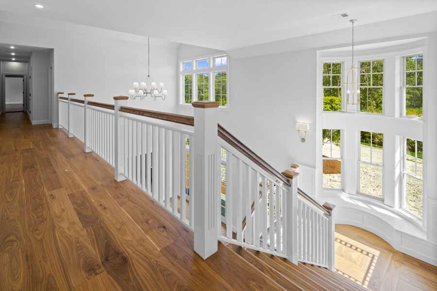 160 Peppercorn Lane Cotuit, MA 02635 - Photo 25 of 43 a view of staircase with wooden floor and windows