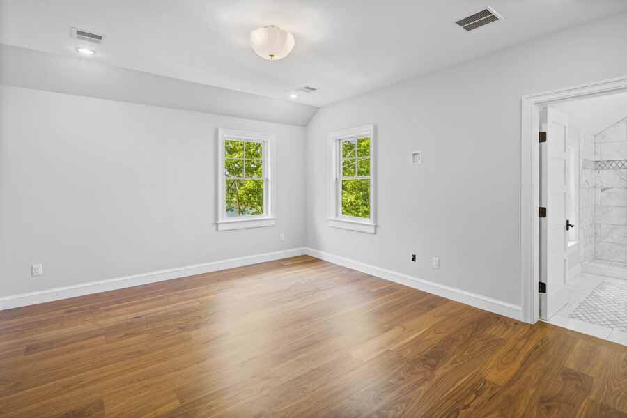 160 Peppercorn Lane Cotuit, MA 02635 - Photo 33 of 43 an empty room with wooden floor and windows