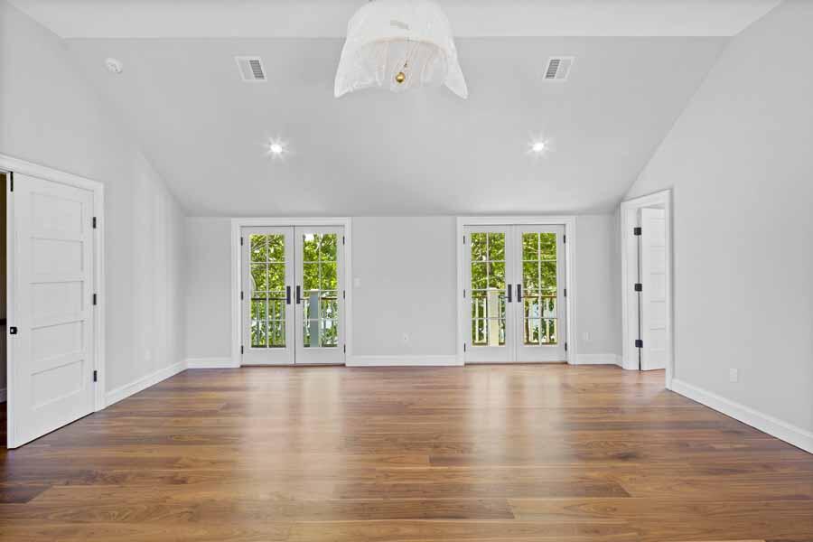 160 Peppercorn Lane Cotuit, MA 02635 - Photo 35 of 43 a view of an empty room with wooden floor and a window