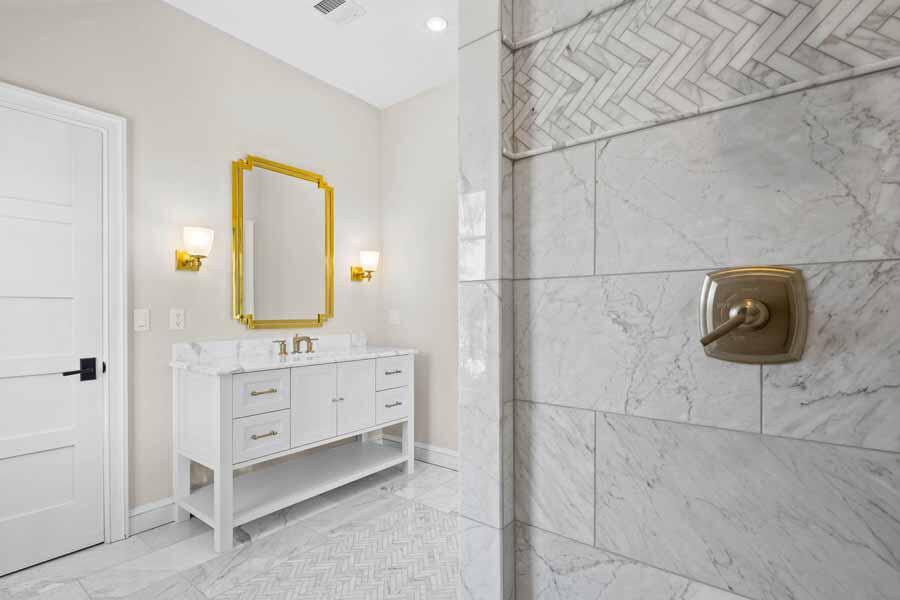 160 Peppercorn Lane Cotuit, MA 02635 - Photo 37 of 43 a bathroom with a double vanity sink toilet and mirror