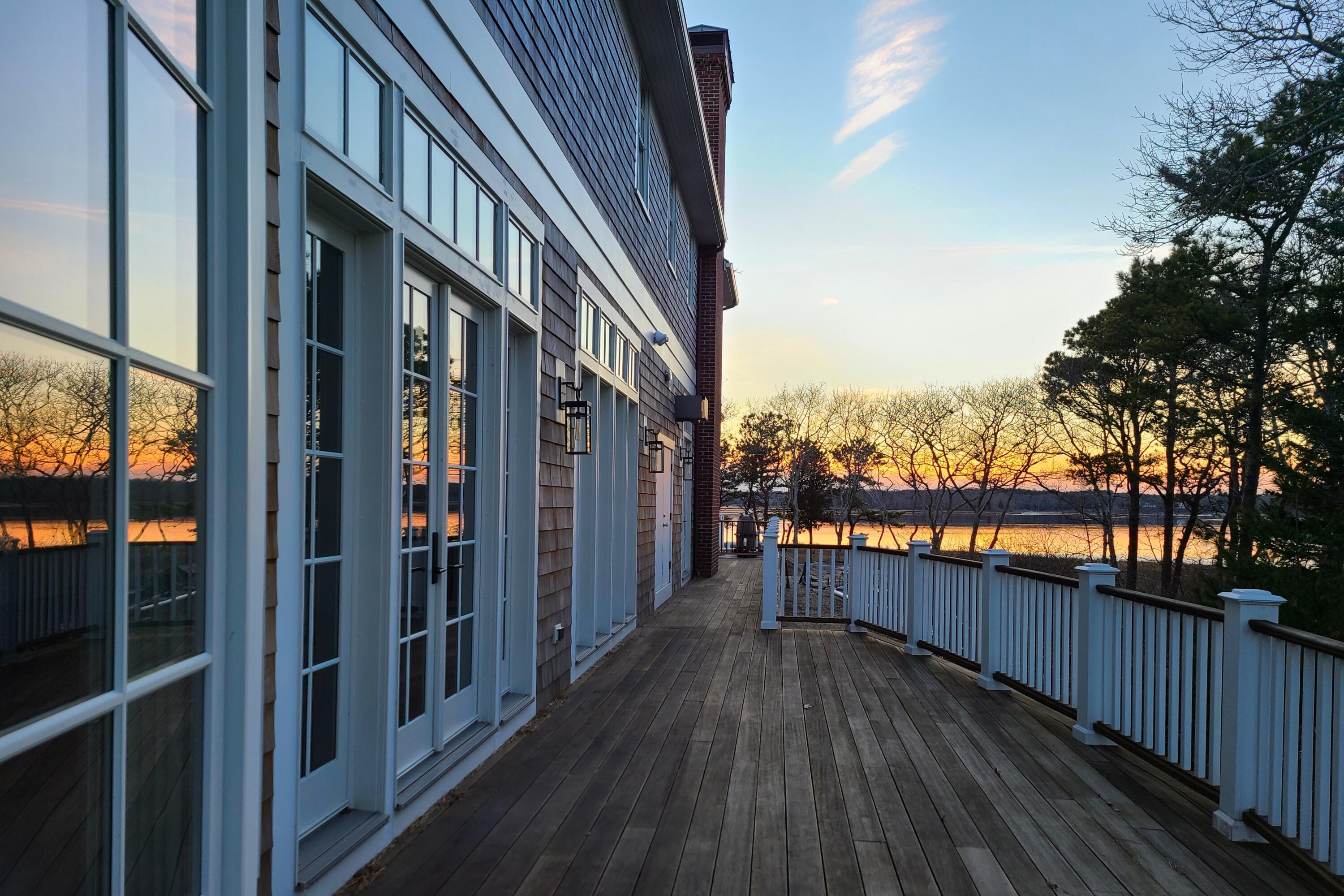 160 Peppercorn Lane Cotuit, MA 02635 - Photo 38 of 43 a view of a balcony with wooden floor and city view
