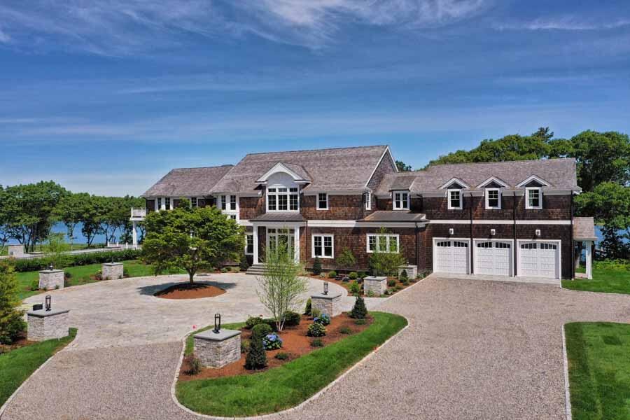 160 Peppercorn Lane Cotuit, MA 02635 - Photo 8 of 43 a front view of a house with a garden