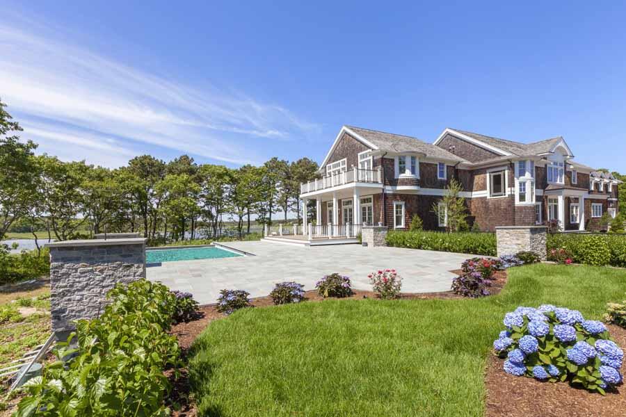 160 Peppercorn Lane Cotuit, MA 02635 - Photo 9 of 43 a front view of a house with a yard