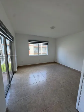an empty room with a hallway