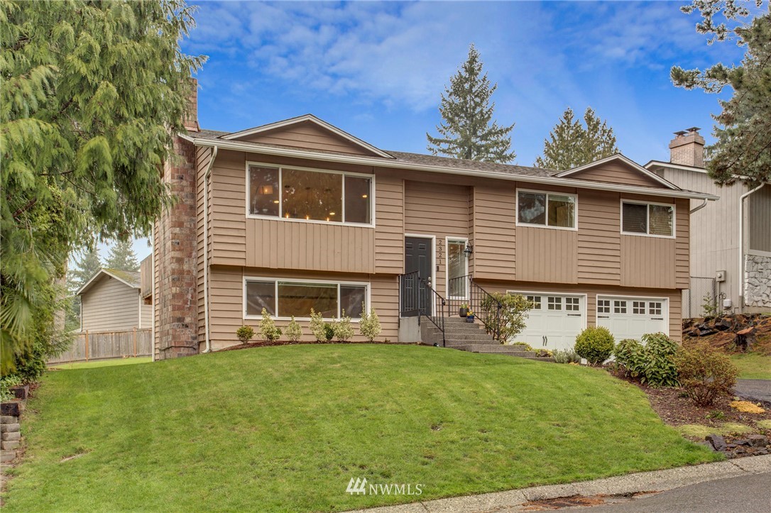 2321 177th Street Southeast Bothell, WA 98012 - Photo 1 of 28 a front view of a house with garden
