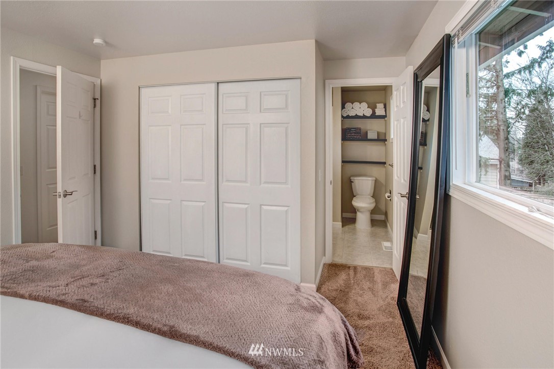 2321 177th Street Southeast Bothell, WA 98012 - Photo 18 of 28 a bedroom with a bed and a large window