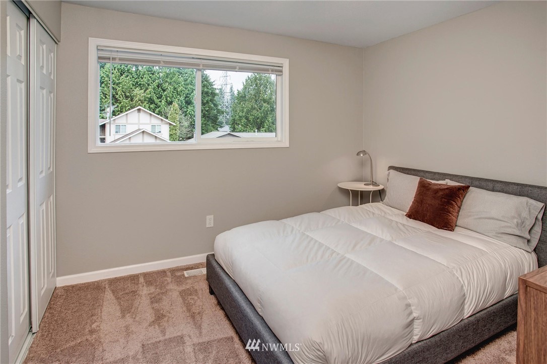 2321 177th Street Southeast Bothell, WA 98012 - Photo 20 of 28 a bedroom with a bed and a window