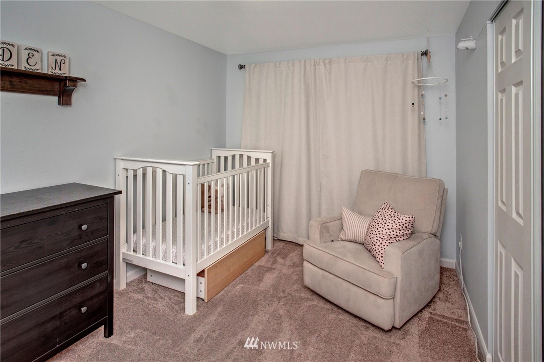 2321 177th Street Southeast Bothell, WA 98012 - Photo 21 of 28 a view of a bedroom with furniture and wooden floor