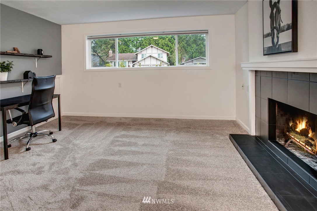 2321 177th Street Southeast Bothell, WA 98012 - Photo 23 of 28 a living room with furniture and a fireplace