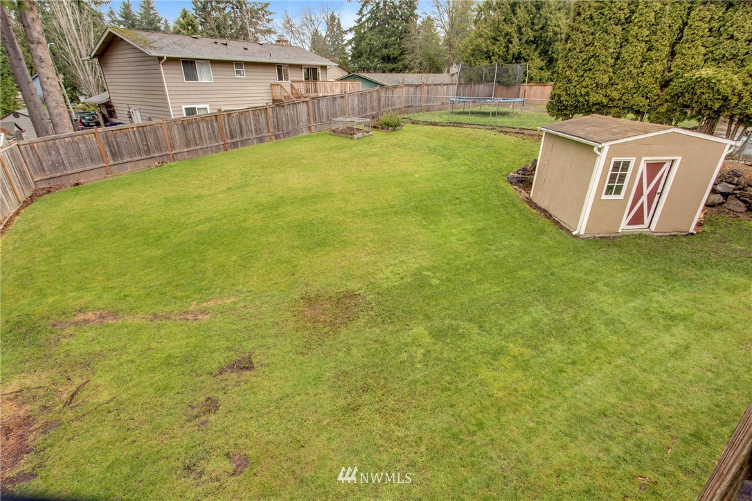 2321 177th Street Southeast Bothell, WA 98012 - Photo 25 of 28 a view of a house with pool and a yard