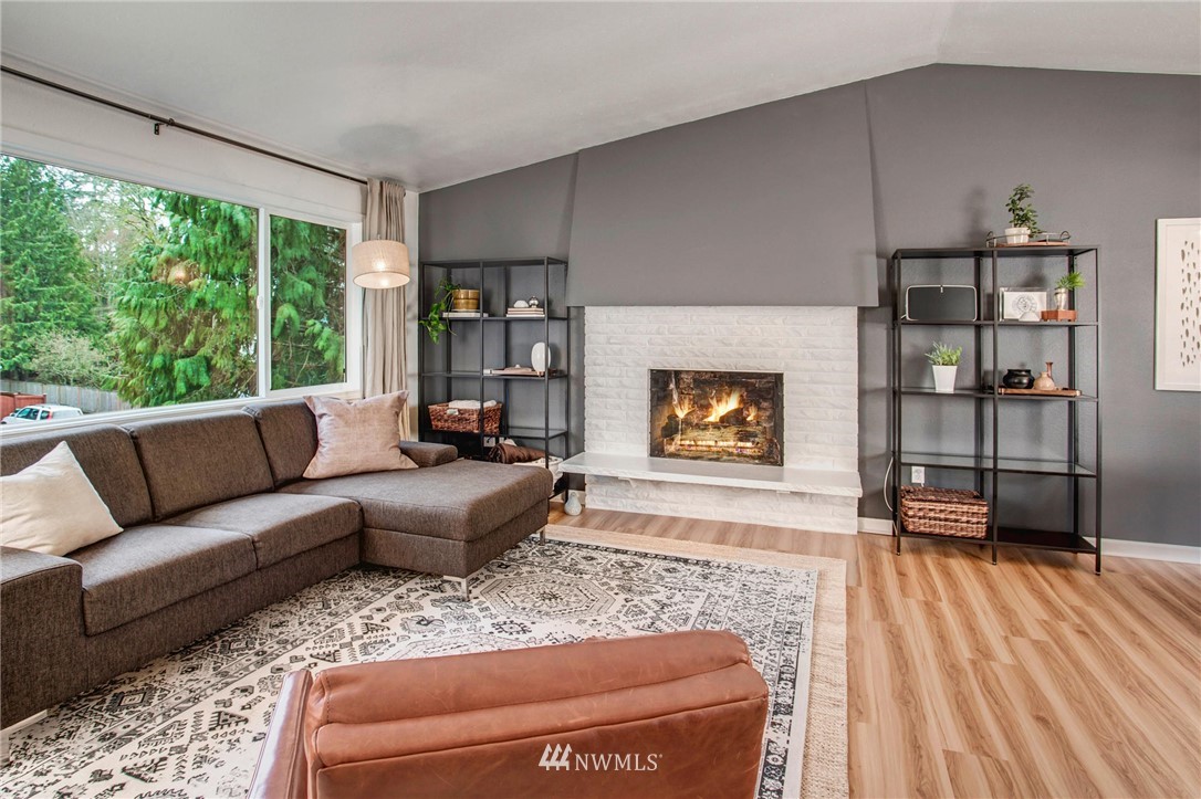 2321 177th Street Southeast Bothell, WA 98012 - Photo 4 of 28 a living room with furniture and a fireplace