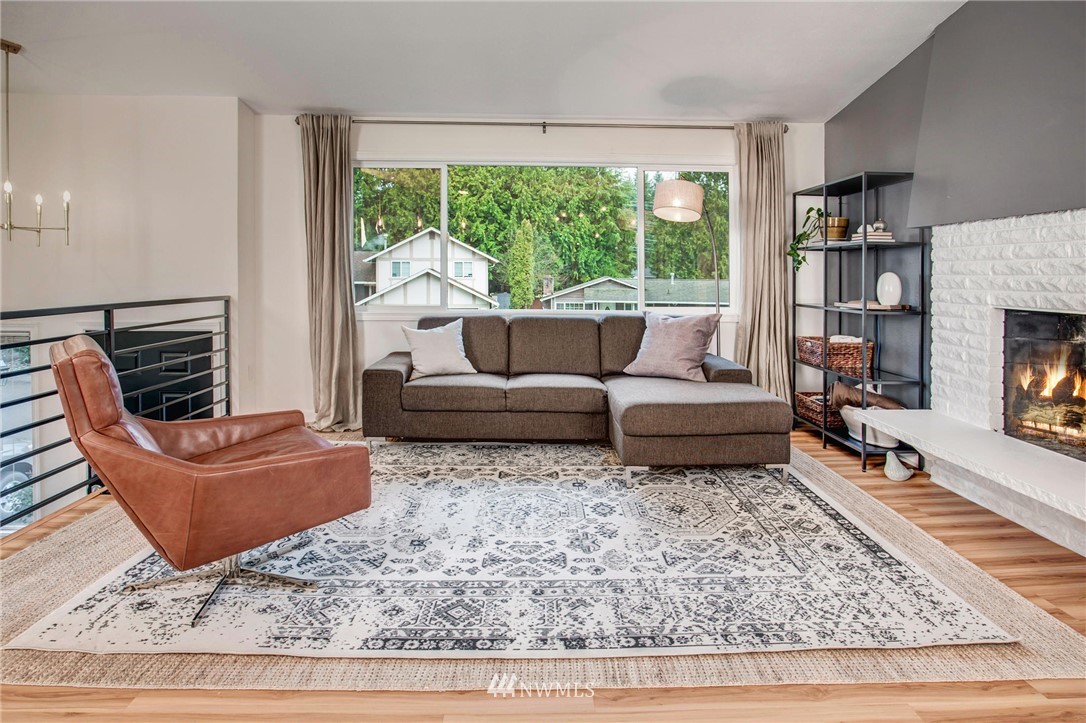 2321 177th Street Southeast Bothell, WA 98012 - Photo 5 of 28 a living room with furniture and a fireplace