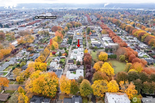 an aerial view of residential houses with outdoor space