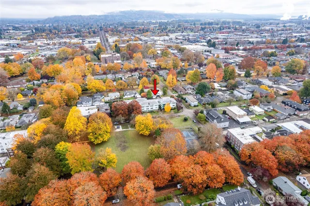 an aerial view of residential houses with outdoor space