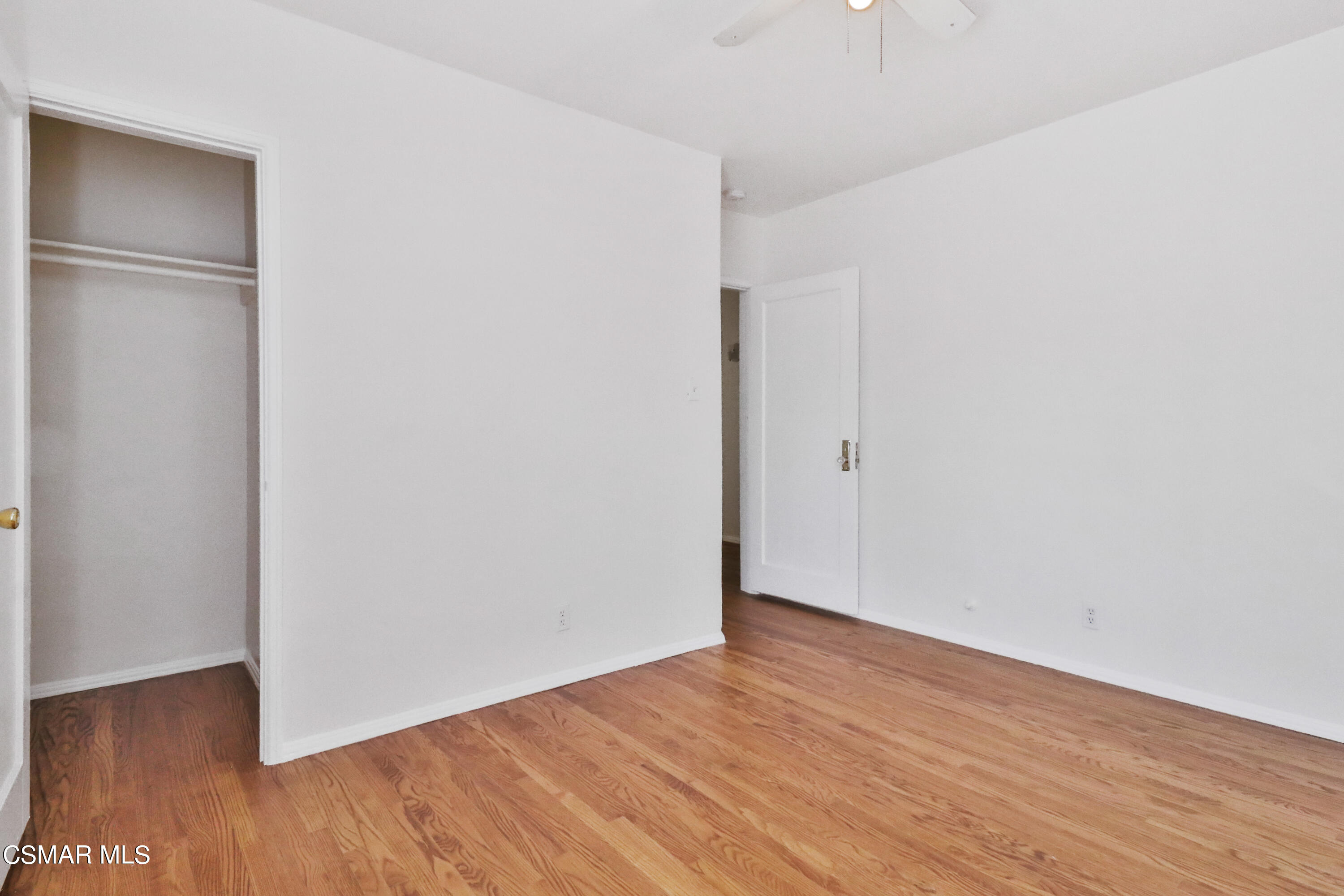 10010 Silverton Avenue Tujunga, CA 91042 - Photo 13 of 30 a view of an empty room with wooden floor