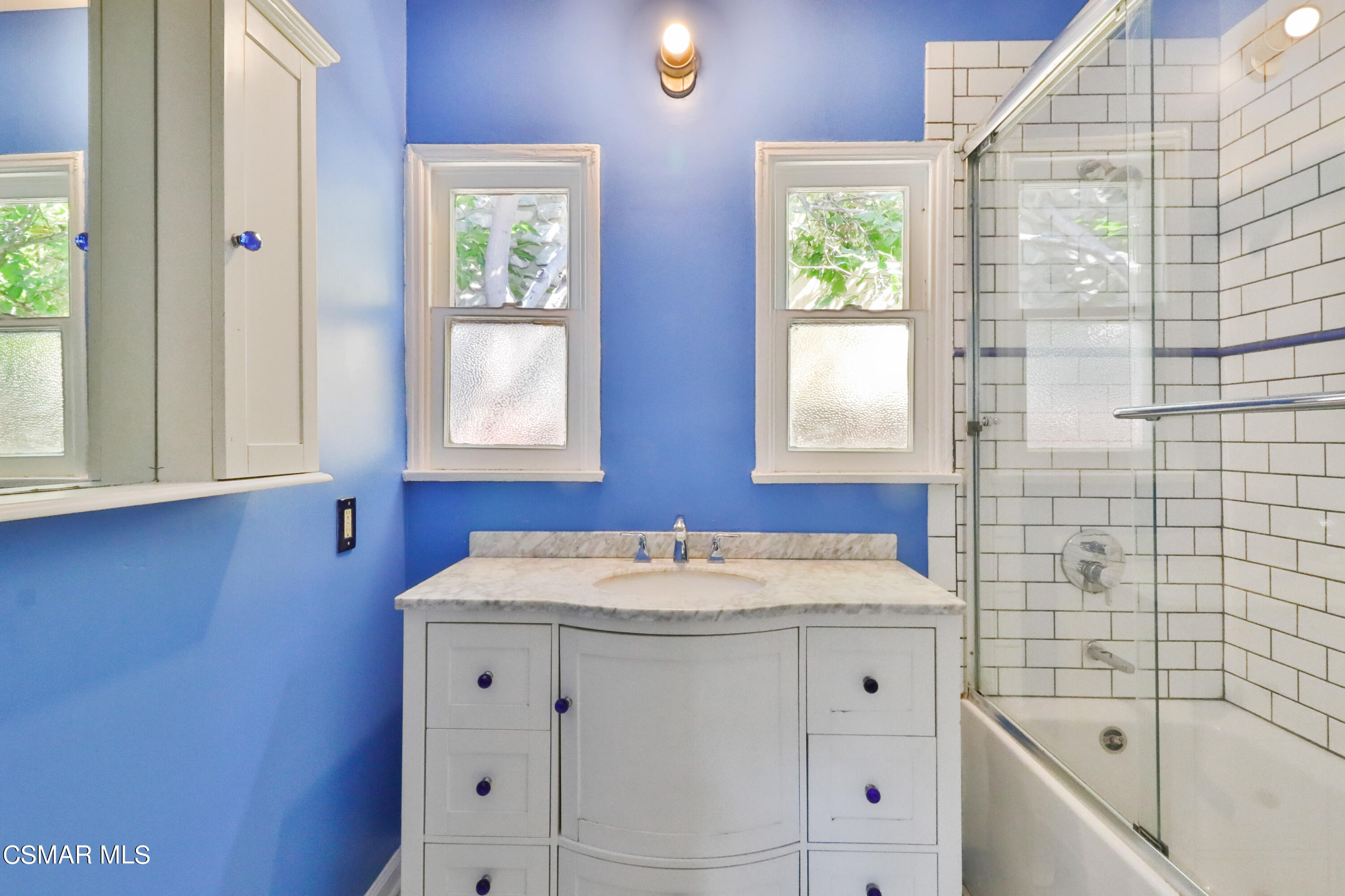 10010 Silverton Avenue Tujunga, CA 91042 - Photo 17 of 30 a bathroom with a sink and a bathtub