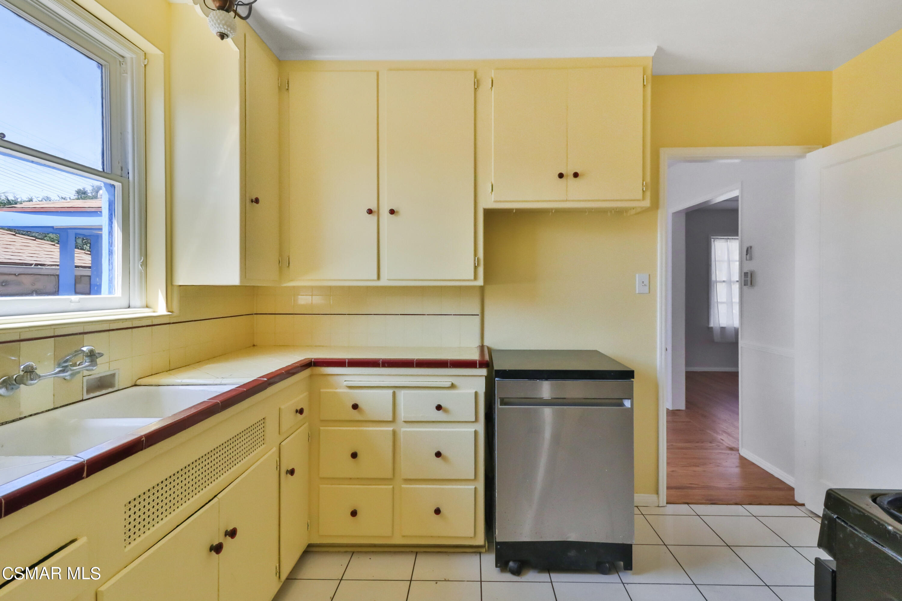 10010 Silverton Avenue Tujunga, CA 91042 - Photo 18 of 30 a kitchen with stainless steel appliances granite countertop a refrigerator and a stove