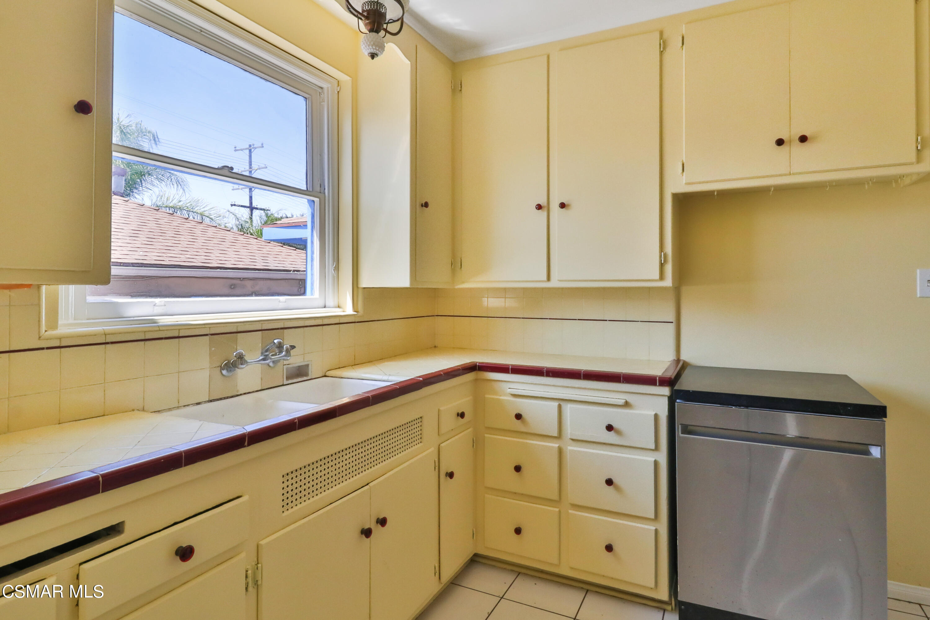 10010 Silverton Avenue Tujunga, CA 91042 - Photo 19 of 30 a bathroom with a sink and a mirror
