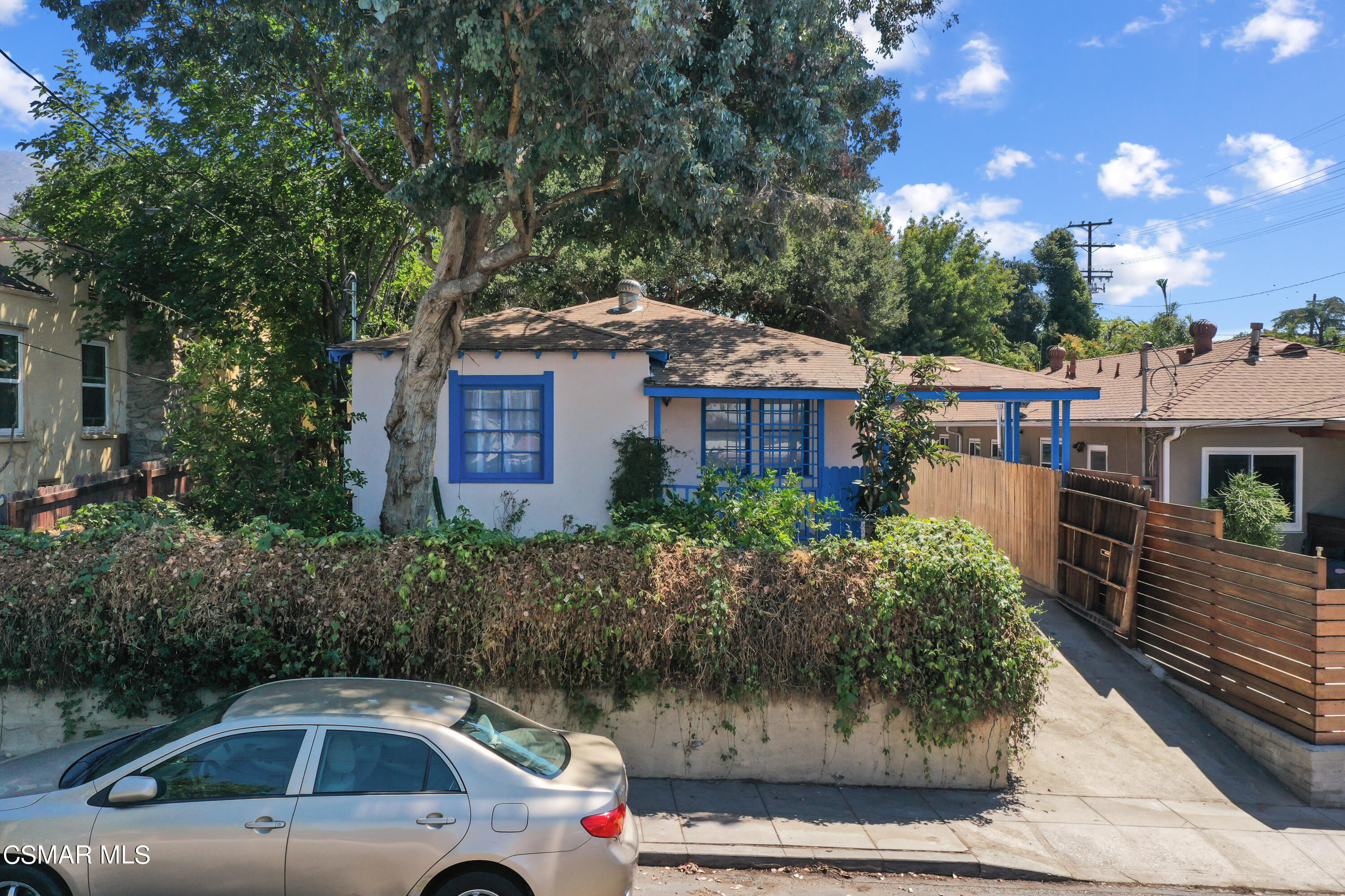 10010 Silverton Avenue Tujunga, CA 91042 - Photo 3 of 30 a front view of a house with parking space