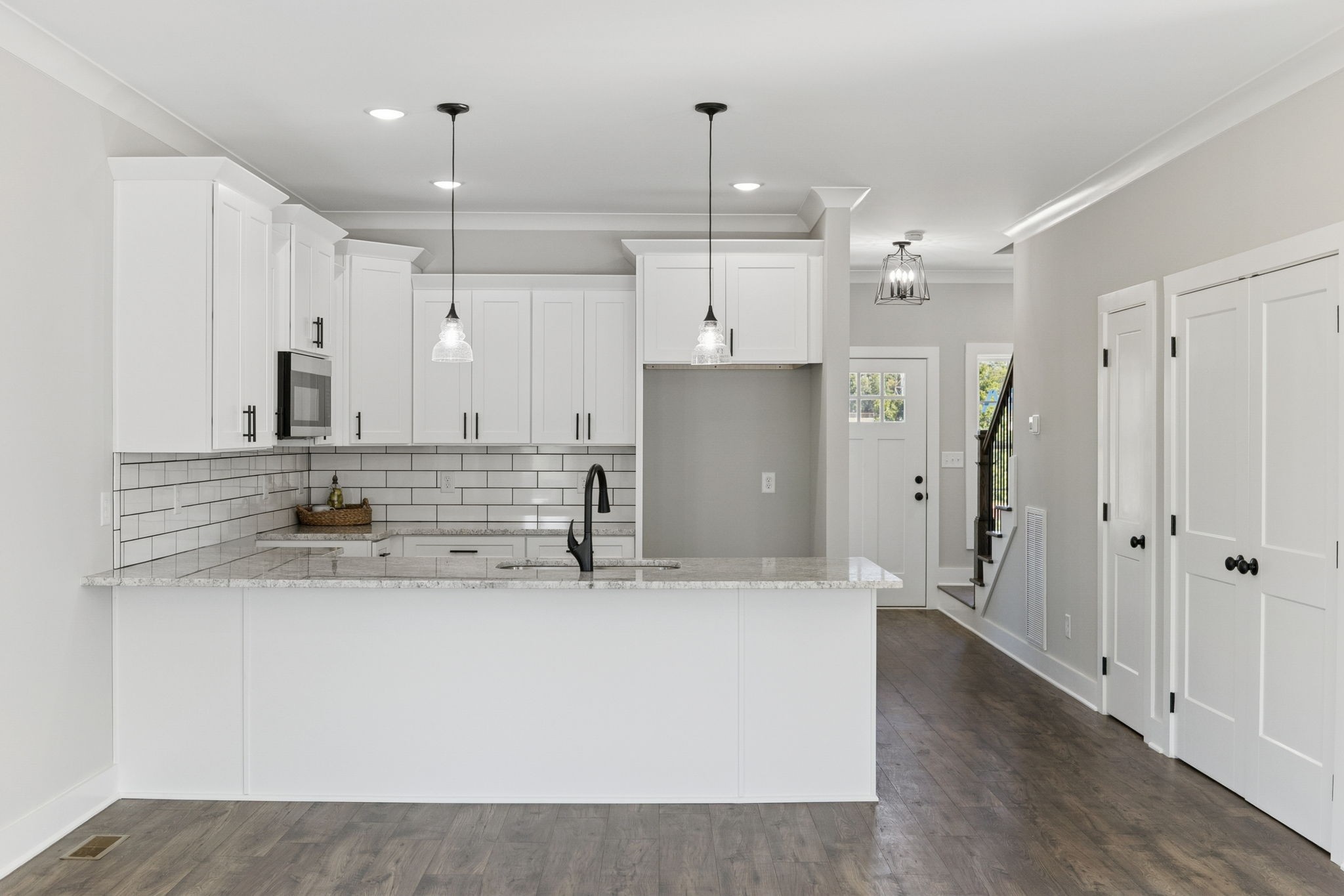 119 East Campbell Road, Unit A Madison, TN 37115 - Photo 11 of 28 a kitchen with stainless steel appliances granite countertop a sink and a refrigerator
