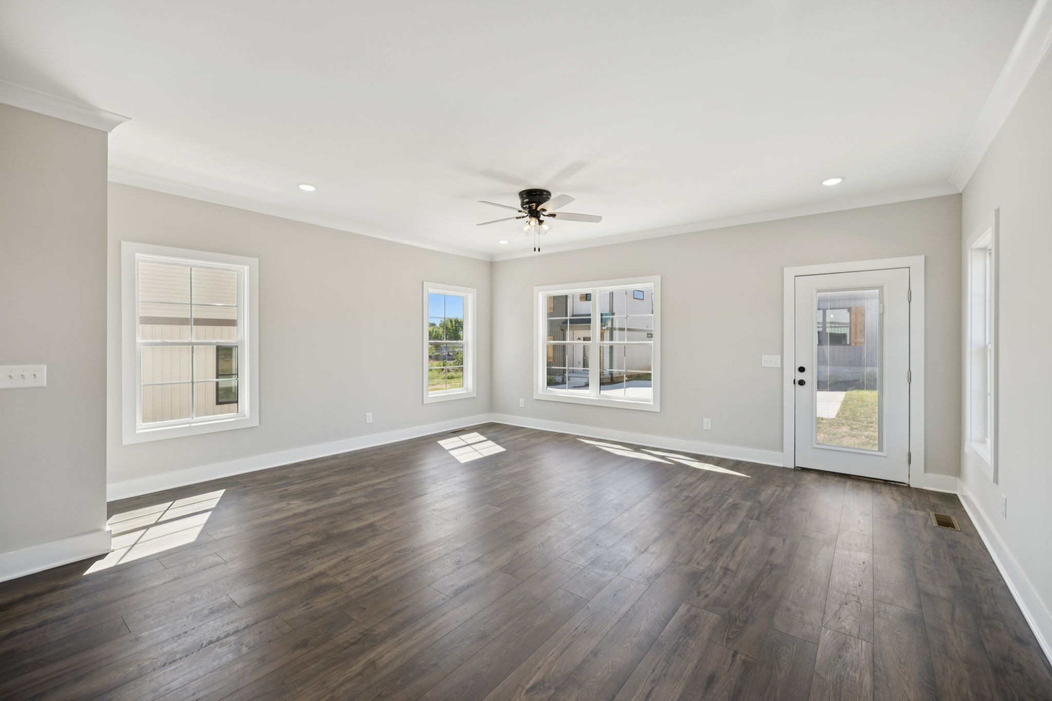 119 East Campbell Road, Unit A Madison, TN 37115 - Photo 13 of 28 an empty room with wooden floor and windows