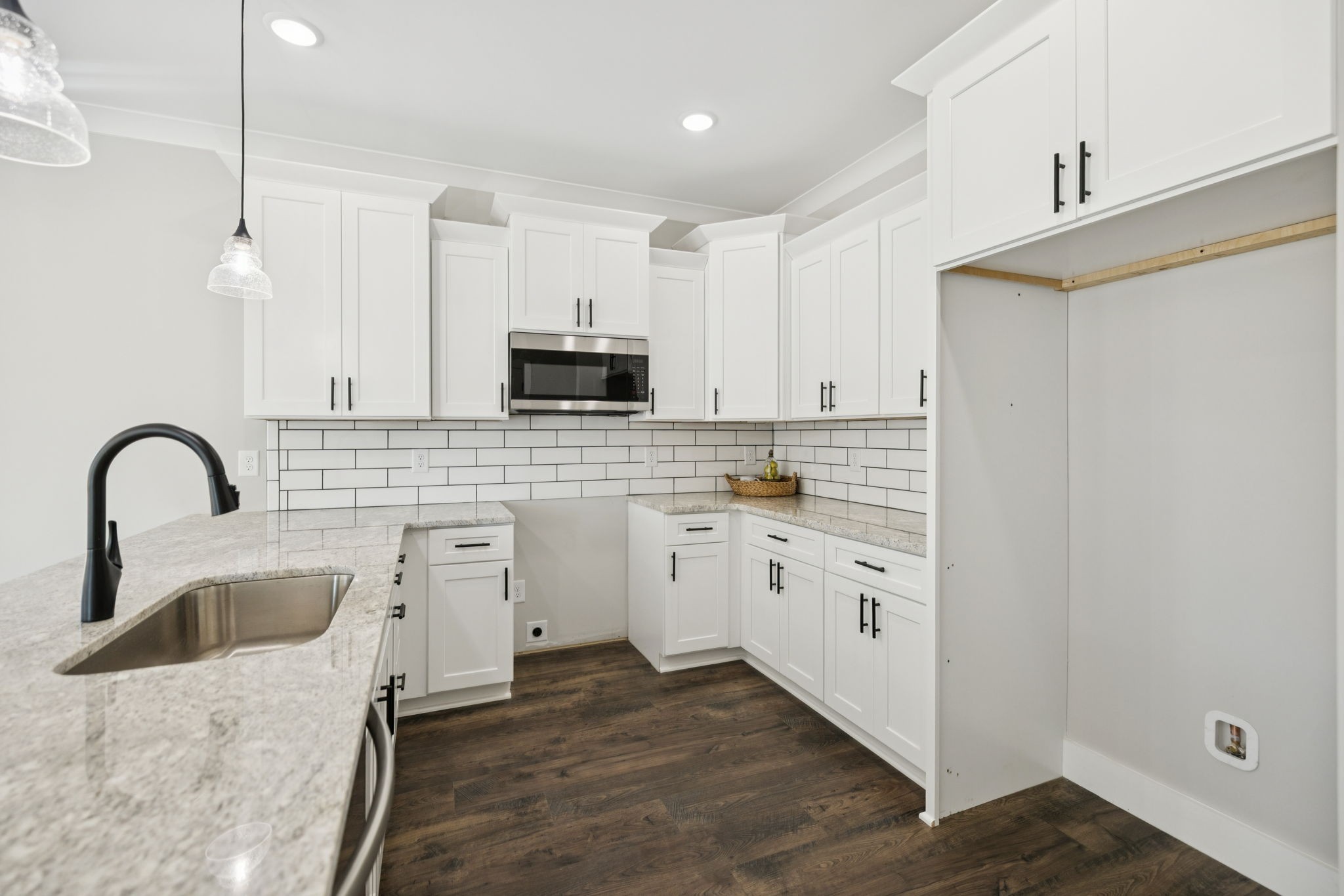119 East Campbell Road, Unit A Madison, TN 37115 - Photo 14 of 28 a kitchen with white cabinets and appliances