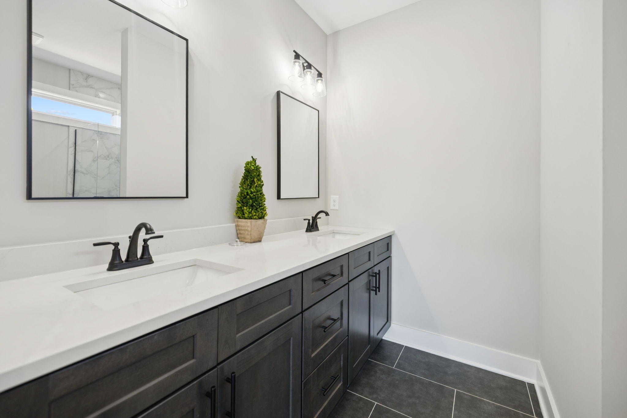 119 East Campbell Road, Unit A Madison, TN 37115 - Photo 20 of 28 a bathroom with a double vanity sink and a mirror