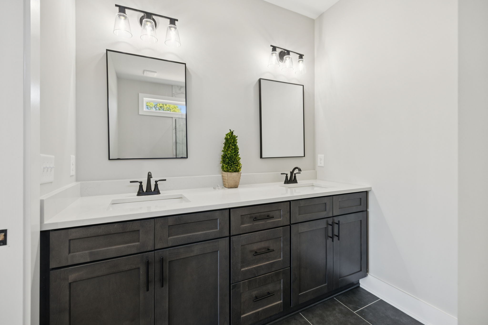 119 East Campbell Road, Unit A Madison, TN 37115 - Photo 22 of 28 a bathroom with a double vanity sink and a mirror