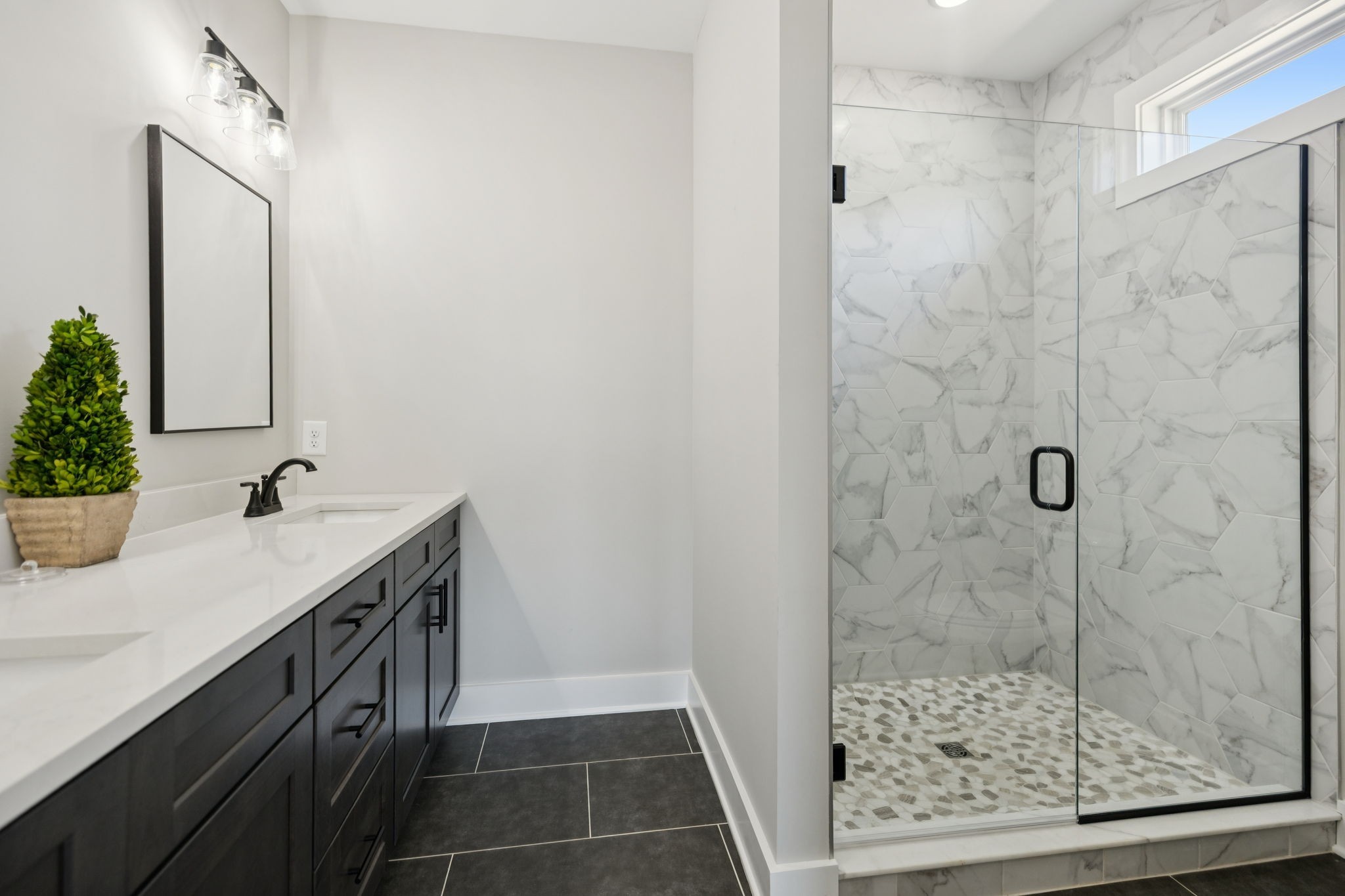 119 East Campbell Road, Unit A Madison, TN 37115 - Photo 23 of 28 a bathroom with a shower sink and mirror