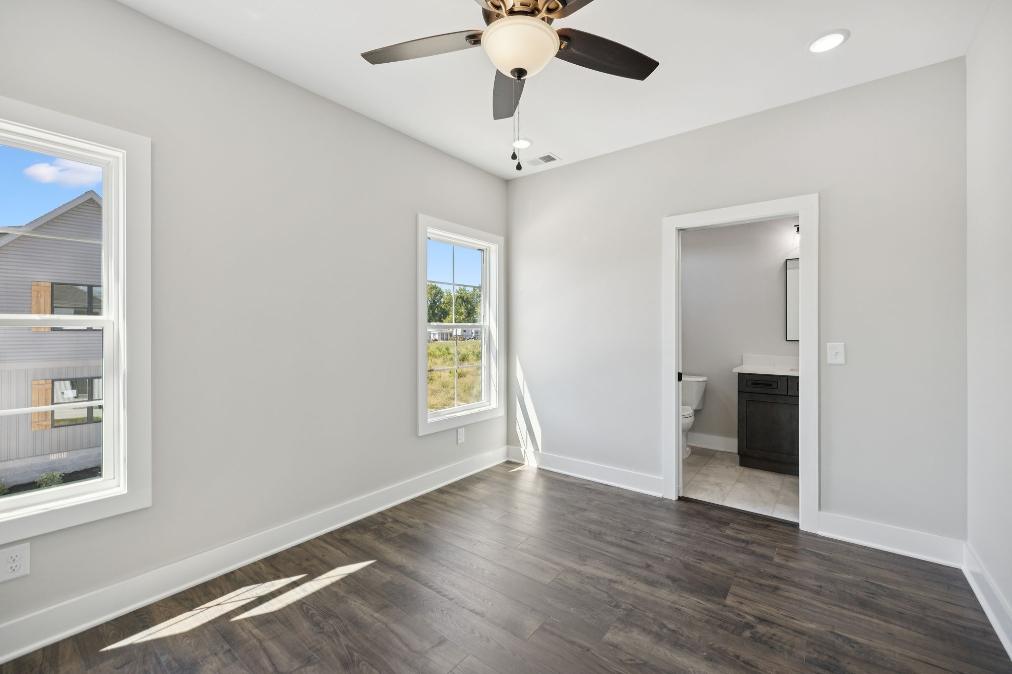 119 East Campbell Road, Unit A Madison, TN 37115 - Photo 27 of 28 a view of an empty room with a window and wooden floor