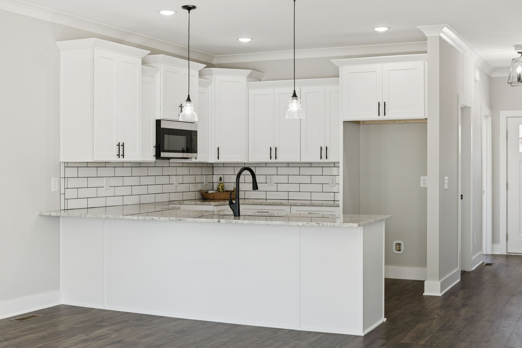 119 East Campbell Road, Unit A Madison, TN 37115 - Photo 8 of 28 a kitchen with stainless steel appliances a sink a refrigerator a center island and a stove