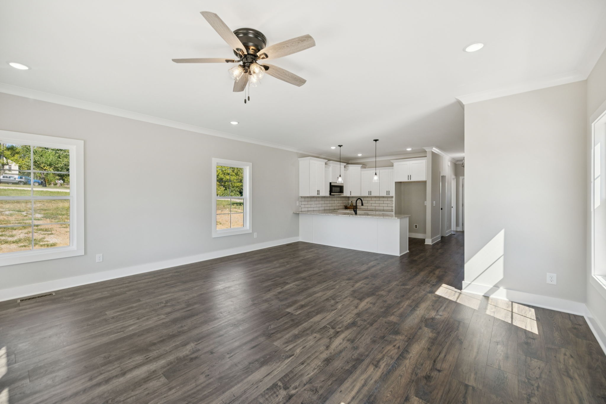 119 East Campbell Road, Unit A Madison, TN 37115 - Photo 9 of 28 a view of a kitchen with wooden floor and a ceiling fan