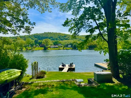 a view of a lake with a yard