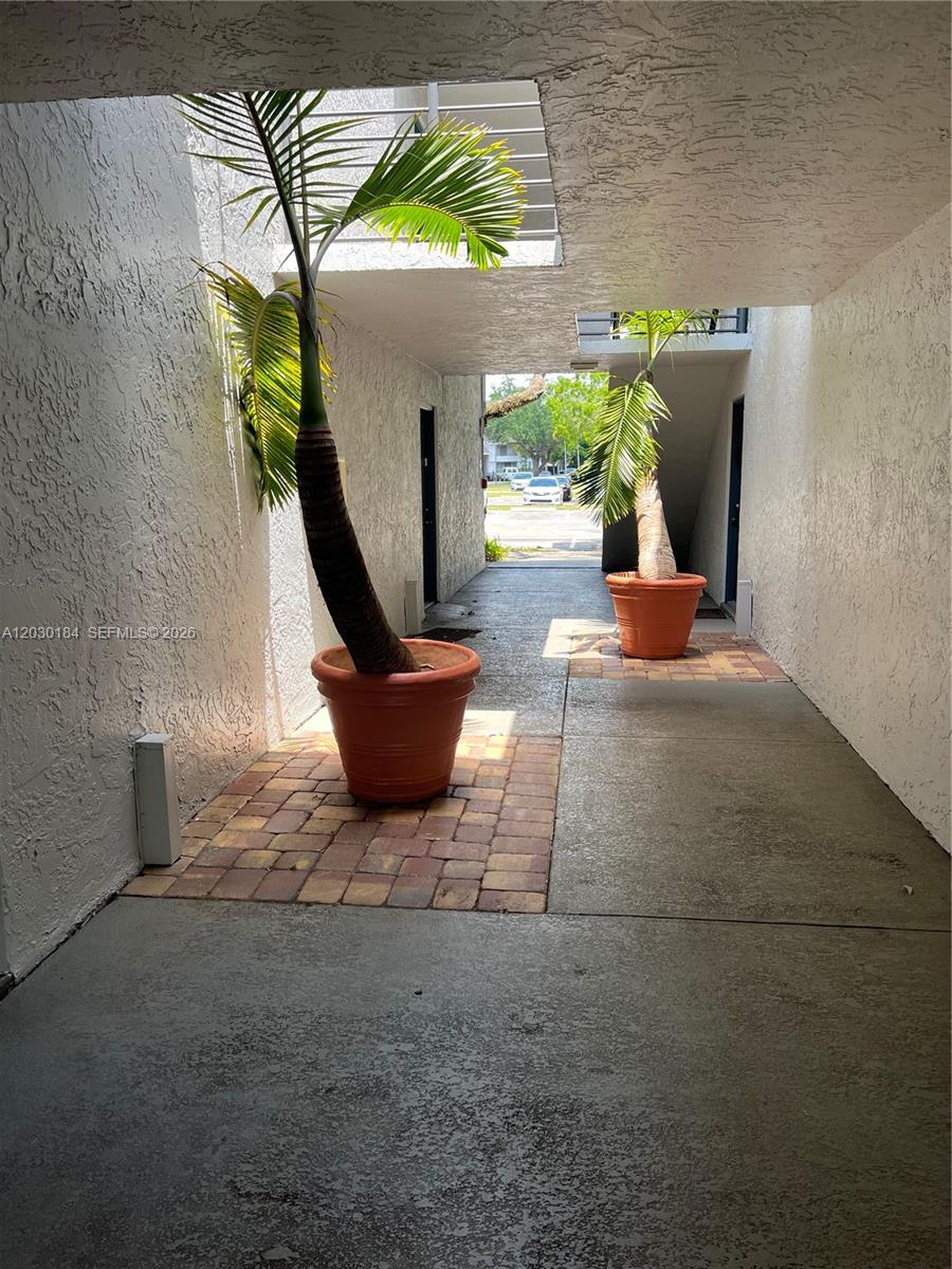 951 Lyons Road, Unit 6104 Coconut Creek, FL 33063 - Photo 11 of 18 a view of a entryway of the house