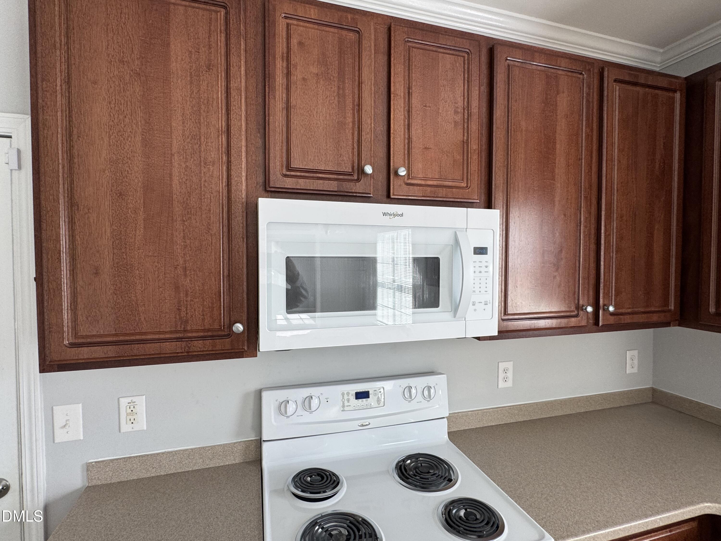 1417 Pleasant Quail Court Raleigh, NC 27603 - Photo 5 of 17 a kitchen with cabinets and white appliances