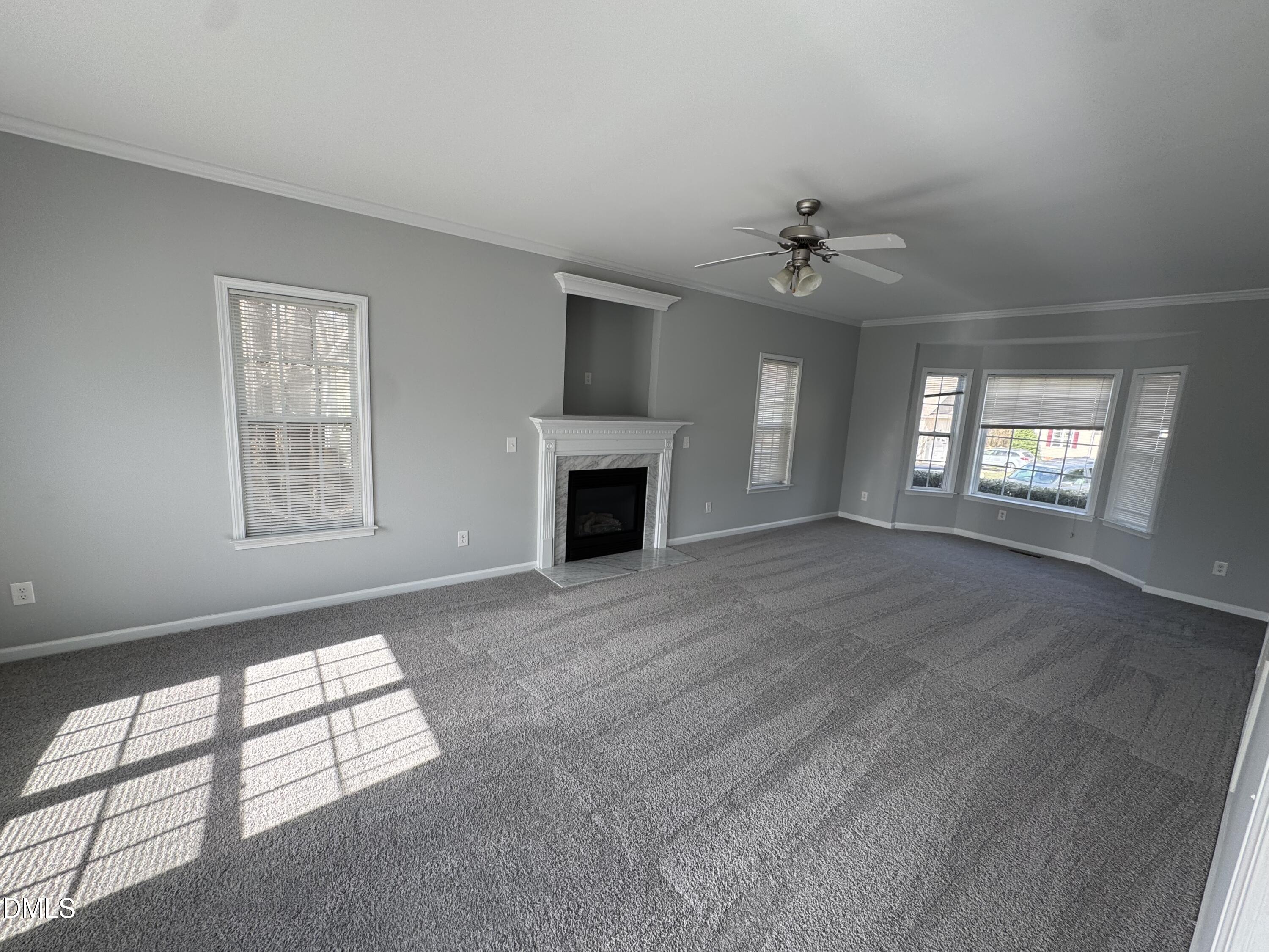 1417 Pleasant Quail Court Raleigh, NC 27603 - Photo 9 of 17 an empty room with windows and fireplace
